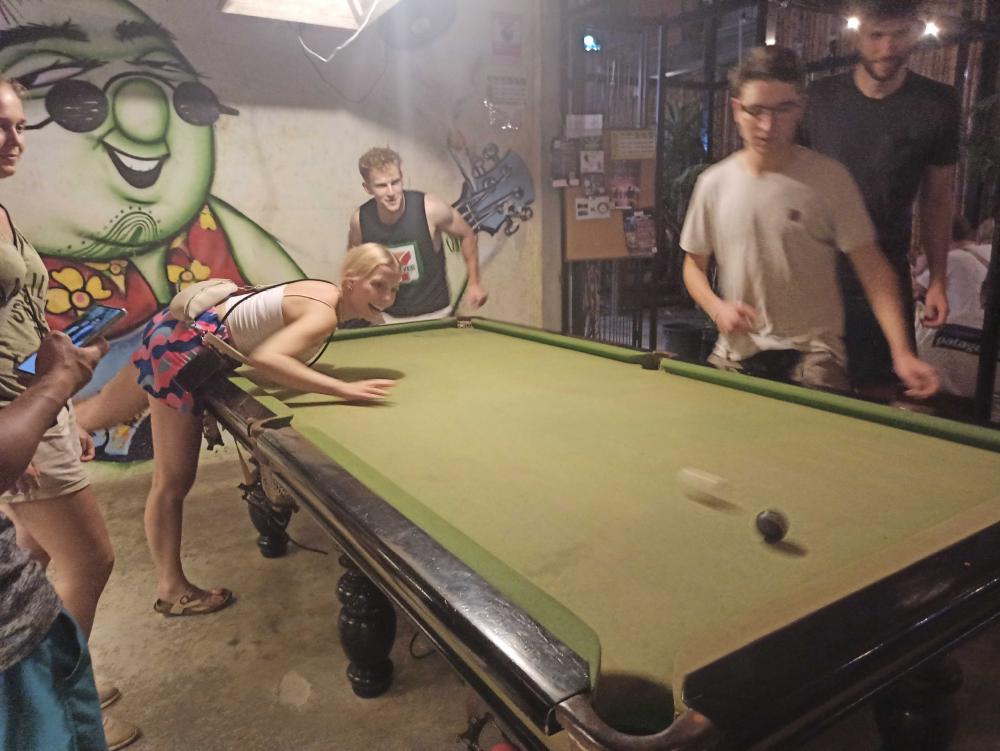 in a bar playing pool games